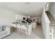 Bright, modern kitchen with white cabinets, island seating, and stainless steel appliances at 14180 Crimson Ave, Bradenton, FL 34211