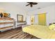 A bright and airy bedroom featuring a comfortable bed, complemented by chic decor and wood laminate flooring at 1447 Landings Cir # 68, Sarasota, FL 34231