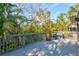 Private outdoor deck surrounded by lush greenery, providing a tranquil setting for relaxation and enjoyment at 1447 Landings Cir # 68, Sarasota, FL 34231