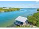 Beautiful waterfront view with private dock and boat, surrounded by natural greenery and clear waters at 1447 Landings Cir # 68, Sarasota, FL 34231