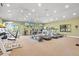 Large gym area with treadmills, elliptical machines, weight machines, and ceiling fans at 1447 Landings Cir # 68, Sarasota, FL 34231