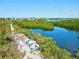 Scenic view of colorful kayaks lined along the waterfront, surrounded by lush vegetation at 1447 Landings Cir # 68, Sarasota, FL 34231