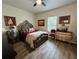 Elegant bedroom with a large bed and ornate furniture at 1790 White Orchid Ct, Sarasota, FL 34235