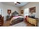 Bedroom featuring hardwood floors, an ornate bed frame, and traditional décor at 1790 White Orchid Ct, Sarasota, FL 34235