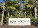 Hammock Place community sign surrounded by lush trees and greenery at 1790 White Orchid Ct, Sarasota, FL 34235