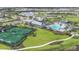 Aerial view of community amenities including tennis courts, pool, and clubhouse at 17903 Palmiste Dr, Bradenton, FL 34202