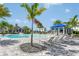 Resort-style pool with lounge chairs and a cabana for shade at 17915 Palmiste Dr, Bradenton, FL 34202