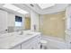 Bright bathroom with shower and bathtub combination, modern lighting, and new fixtures at 185 Vista Hermosa Circle, Sarasota, FL 34242