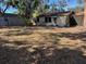 View of the back of the house and a large backyard at 1958 Bougainvillea St, Sarasota, FL 34239