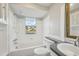 Bathroom with a shower-tub combo, gray countertops, modern fixtures, and a mirrored vanity at 2079 Pellam Blvd, Port Charlotte, FL 33948