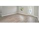 Open living area showcasing new floors, base molding, and neutral paint at 2079 Pellam Blvd, Port Charlotte, FL 33948