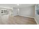 Bright and airy living room with modern flooring and a seamless flow to the sunroom at 2079 Pellam Blvd, Port Charlotte, FL 33948