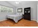 Bright bedroom with hardwood floors and a ceiling fan at 221 Lychee Rd, Nokomis, FL 34275