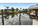 Calm waters reflect the sky and surrounding homes at 221 Lychee Rd, Nokomis, FL 34275