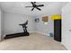 Home gym with treadmill, weights, and plenty of space at 221 Lychee Rd, Nokomis, FL 34275