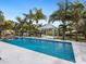 Sparkling pool with waterfall feature and gazebo at 221 Lychee Rd, Nokomis, FL 34275