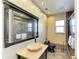 Modern bathroom featuring a vessel sink, black toilet, and tiled shower with glass doors at 2211 42Nd W St, Bradenton, FL 34205