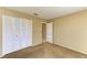 Bedroom featuring a closet and view to hall, complemented by neutral walls at 2211 42Nd W St, Bradenton, FL 34205