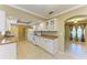 Bright kitchen with white cabinetry and tile flooring at 2211 42Nd W St, Bradenton, FL 34205