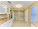 Bright, open kitchen area featuring pantry cabinets with open doors, tile flooring, and granite countertops at 2211 42Nd W St, Bradenton, FL 34205