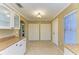 Bright, open kitchen area featuring pantry cabinets, tile flooring, and granite countertops with recessed lighting at 2211 42Nd W St, Bradenton, FL 34205