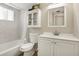 Bright bathroom featuring a shower/tub combo and white vanity with storage at 2211 Sunset Dr # E3, Bradenton, FL 34207