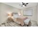 Cozy bedroom with a ceiling fan, wood-look floors and neutral color palette at 2211 Sunset Dr # E3, Bradenton, FL 34207