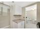 Galley kitchen featuring granite countertops, white cabinetry, and a bright and airy feel at 2211 Sunset Dr # E3, Bradenton, FL 34207