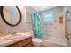 An additional bathroom features a vanity sink, toilet, and bathtub with shower at 2407 Amanda Dr, Sarasota, FL 34232