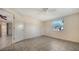 Bedroom with tile flooring, neutral walls, and a window providing natural light at 2407 Amanda Dr, Sarasota, FL 34232