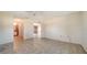 Bedroom featuring tile flooring, neutral walls, and access to the en-suite bathroom at 2407 Amanda Dr, Sarasota, FL 34232