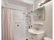 Updated bathroom with walk-in shower and white vanity at 2822 Maple Ave, Sarasota, FL 34234