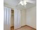 Bedroom with tile floors, ceiling fan, and closet at 2822 Maple Ave, Sarasota, FL 34234