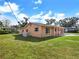 Charming single-story home featuring a covered front porch and a spacious lawn at 2822 Maple Ave, Sarasota, FL 34234