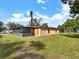 Back view of the house with a sunroom at 2822 Maple Ave, Sarasota, FL 34234