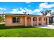 Single story house with a well-manicured lawn at 2822 Maple Ave, Sarasota, FL 34234