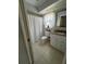 Bathroom featuring a white vanity with granite top and a window above the toilet at 2930 Tuckerstown Dr, Sarasota, FL 34231