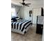 Nautical bedroom with striped bedding and multiple closets at 2930 Tuckerstown Dr, Sarasota, FL 34231