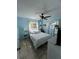 Sunlit bedroom with nautical-themed decor and a ceiling fan at 2930 Tuckerstown Dr, Sarasota, FL 34231