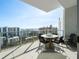 Condo balcony featuring outdoor seating with panoramic city and bay views at 301 Quay Commons # 1809, Sarasota, FL 34236