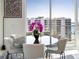 Dining table with natural light and city views at 301 Quay Commons # 1809, Sarasota, FL 34236