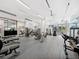 Spacious fitness center featuring state-of-the-art exercise equipment and ample natural light at 301 Quay Commons # 1809, Sarasota, FL 34236