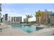 Rooftop pool with sun loungers, umbrellas and a view of the city skyline at 301 Quay Commons # 1809, Sarasota, FL 34236