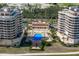 Aerial view of community pool and residential buildings at 3070 Grand Bay Blvd # 625, Longboat Key, FL 34228