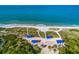 Beachfront property with blue beach shelters at 3070 Grand Bay Blvd # 625, Longboat Key, FL 34228