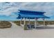 Blue beach shelter with picnic table at 3070 Grand Bay Blvd # 625, Longboat Key, FL 34228