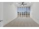 Spacious bedroom with ceiling fan, carpet, and plantation shutters at 3070 Grand Bay Blvd # 625, Longboat Key, FL 34228