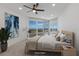 Virtually staged bedroom with water views and a ceiling fan at 3070 Grand Bay Blvd # 625, Longboat Key, FL 34228