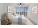 Spacious bedroom with twin beds and plenty of natural light at 3070 Grand Bay Blvd # 625, Longboat Key, FL 34228