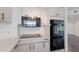 Modern kitchen features a built-in microwave, oven, and electric cooktop at 3070 Grand Bay Blvd # 625, Longboat Key, FL 34228